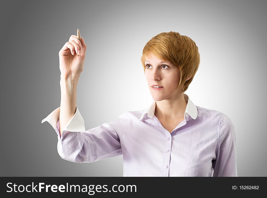 Attractive young woman with pen