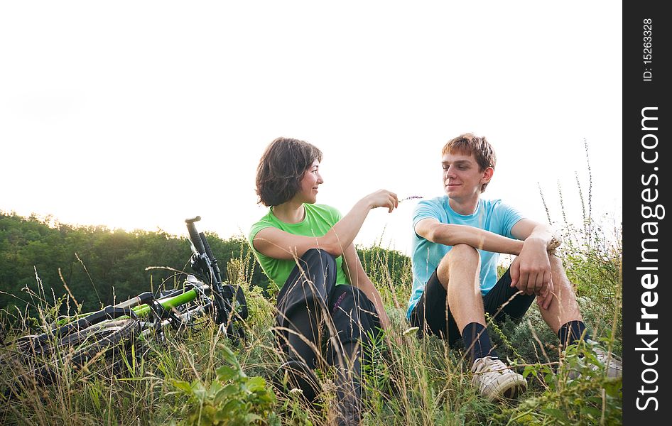 Two cyclists relax biking outdoors