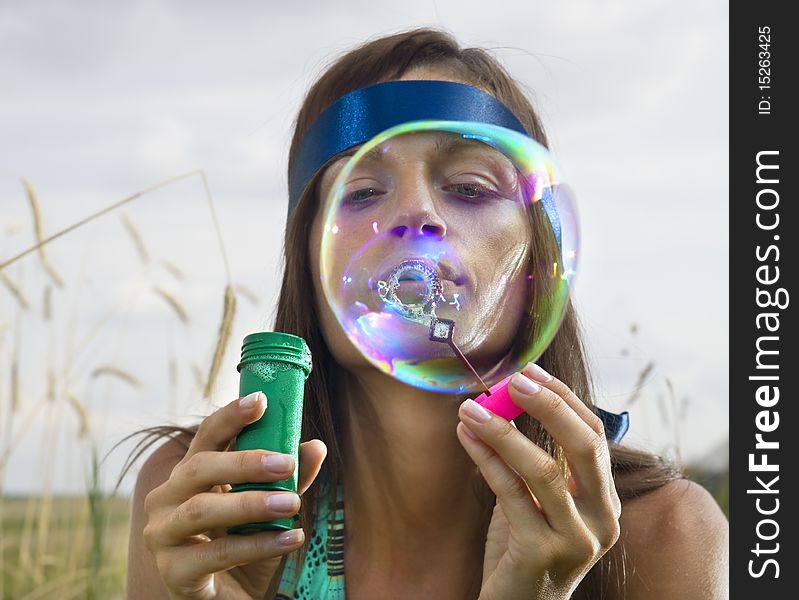 Face Of Woman That Blows Soap Bubbles