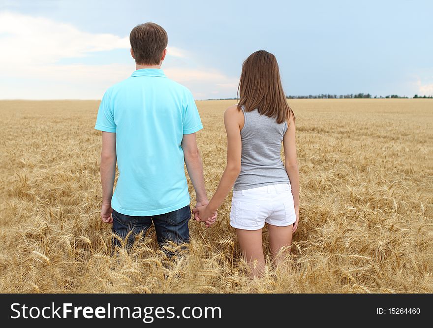 Young couple in the wheat field. Young couple in the wheat field