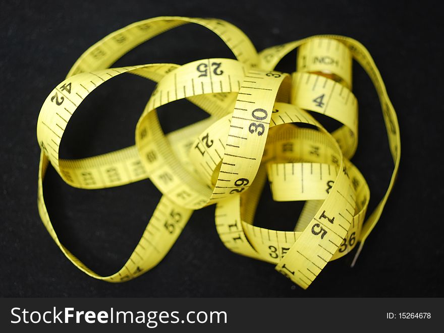 A tape measure or measuring tape, a flexible form of ruler, for use to measure one's body, use at home or by tailor and health instructor. A tape measure or measuring tape, a flexible form of ruler, for use to measure one's body, use at home or by tailor and health instructor.