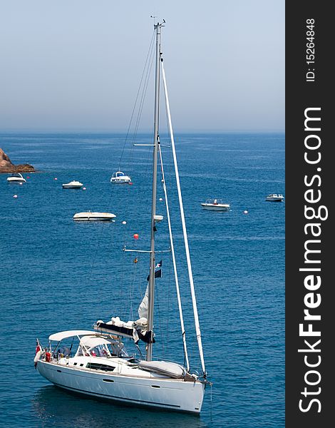 Pleasure boat on calm blue sea. Summer vacation. Pleasure boat on calm blue sea. Summer vacation