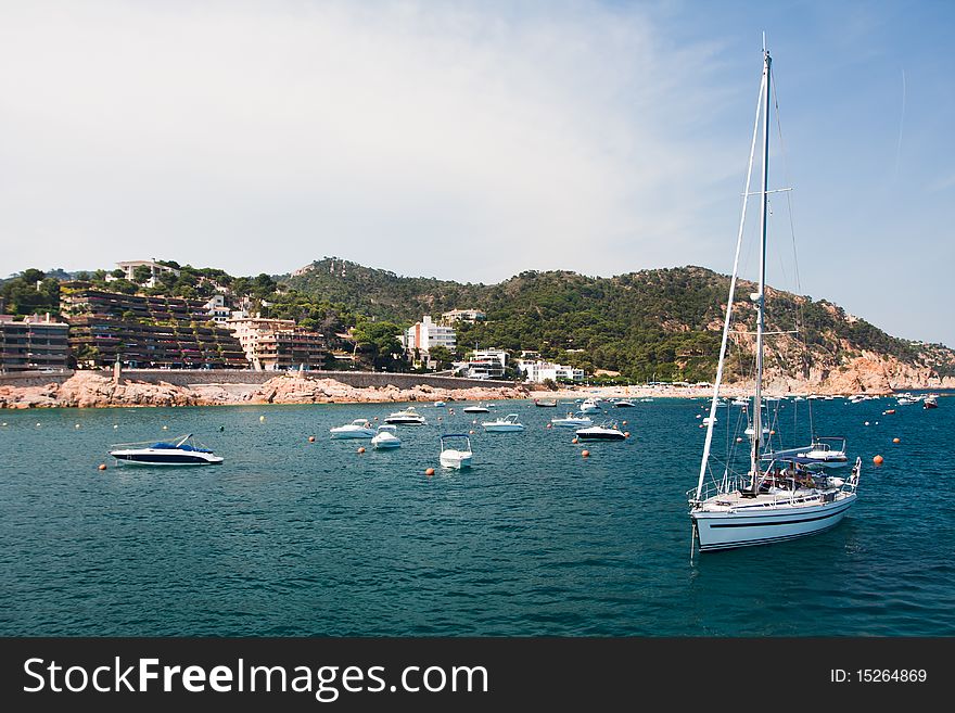 Yacht in harbour. Spanish coastline - Costa Brava Spanish coastline - Costa Brava. Yacht in harbour. Spanish coastline - Costa Brava Spanish coastline - Costa Brava