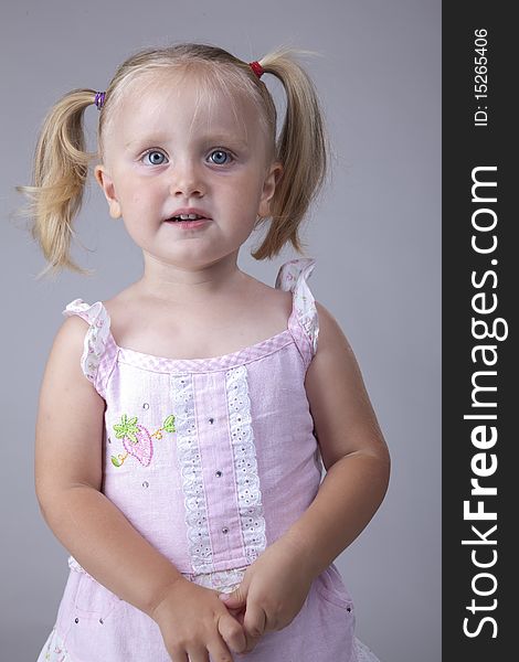 Beautiful little girl portrait with big blue eyes