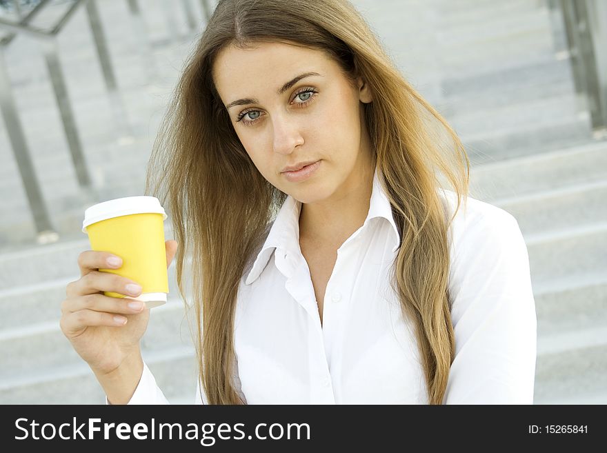 Young successful businesswoman having a coffebreak. Young successful businesswoman having a coffebreak