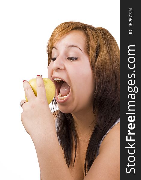 A pretty young woman holding an apple she's about to eat. A pretty young woman holding an apple she's about to eat