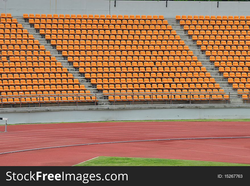 Empty orange seat in stadium