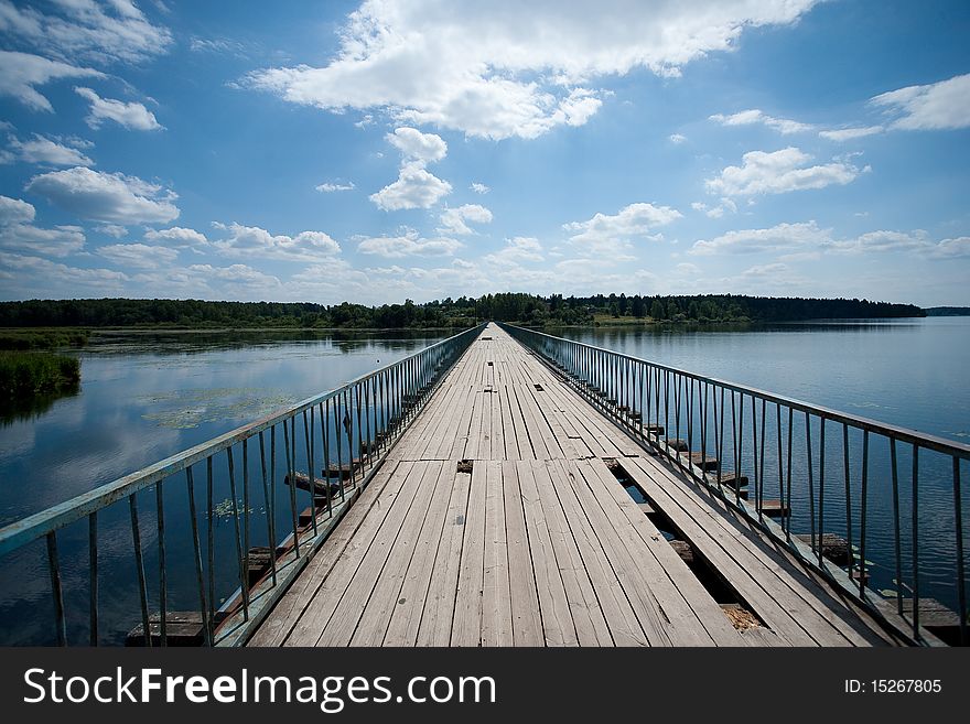 An old bridge across the lake Senezh in Podmoskovye, Russia