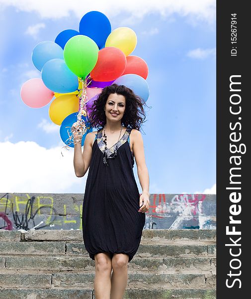 Woman with colorful balloons