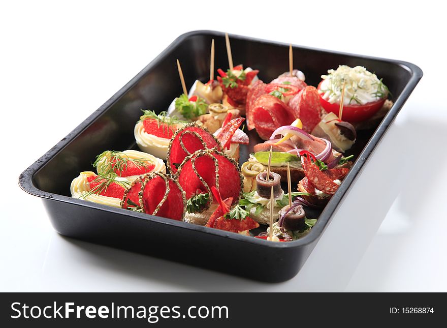Variety of hors d'oeuvres on a baking tray