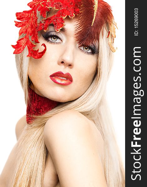 Beautiful fashionable woman with art leaves on head