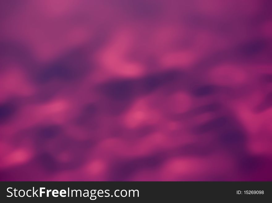 A dark pink and mauve blured background. A dark pink and mauve blured background