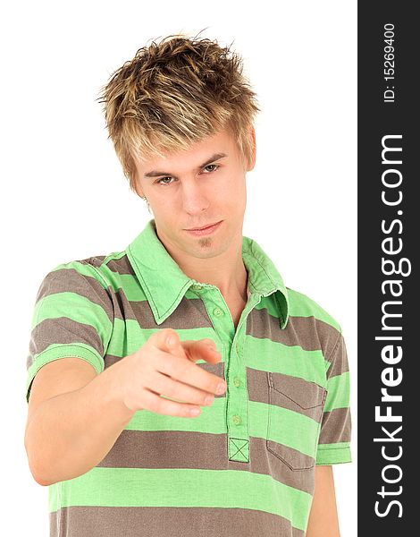 Portrait of teenage boy in striped green shirt pointing at camera, studio shot. Portrait of teenage boy in striped green shirt pointing at camera, studio shot
