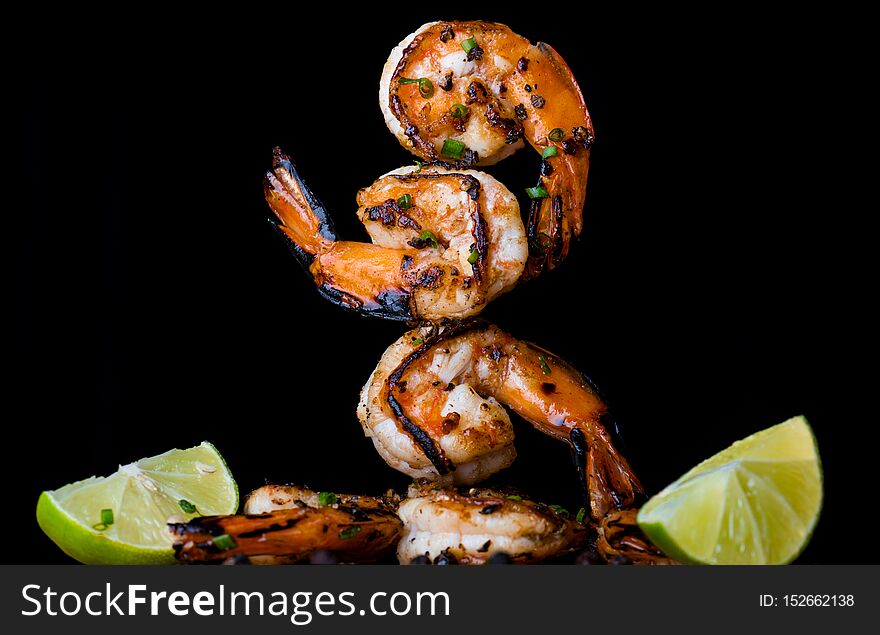 Skewer shrimps burnt grilled with spice seasoning with dark background