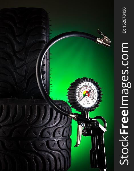 Tire Pressure Gauge On Dark Background Close-up