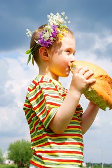 Boy Biting A Loaf Of Bread Stock Images Boy Biting A Loaf Of Bread Stock Images