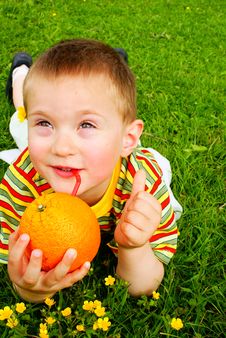 The Child Is Drinking Orange Juice Royalty Free Stock Image The Child Is Drinking Orange Juice Royalty Free Stock Image