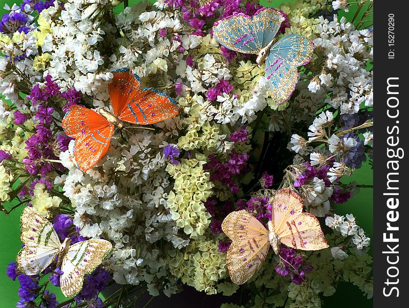 Decorative colourful butterflies on flowers. Decorative colourful butterflies on flowers