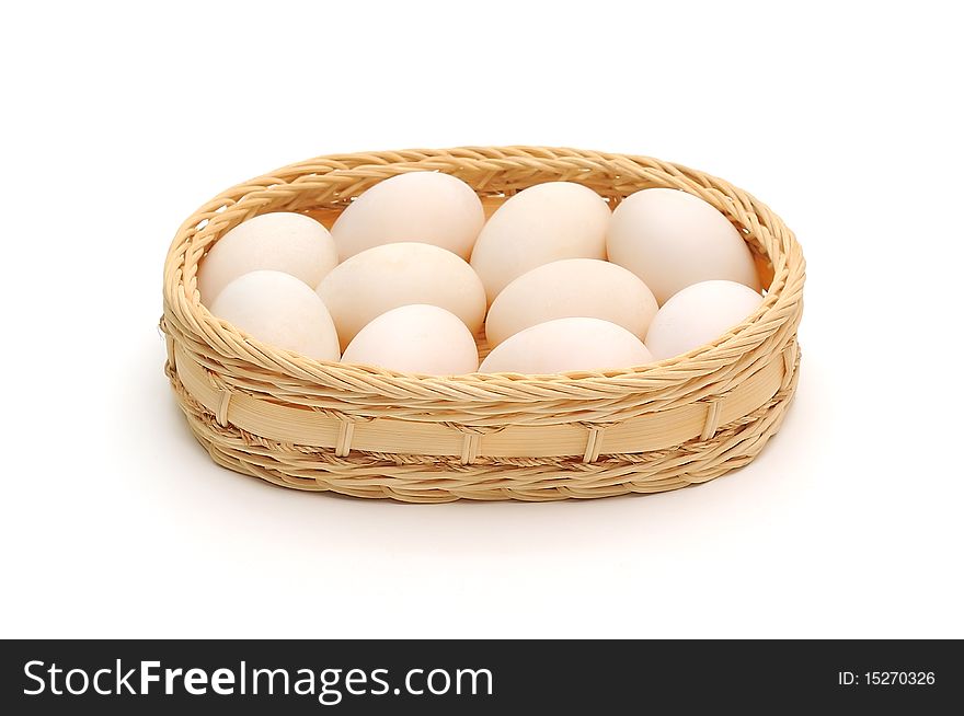 Eggs in Basket isolated on white background