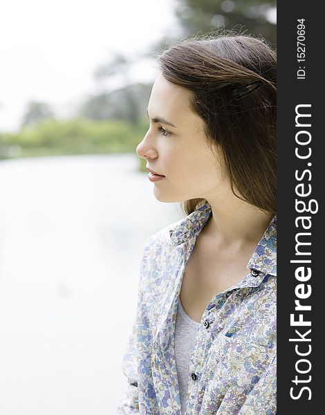 Profile of a Pretty Teenage Girl in a Park