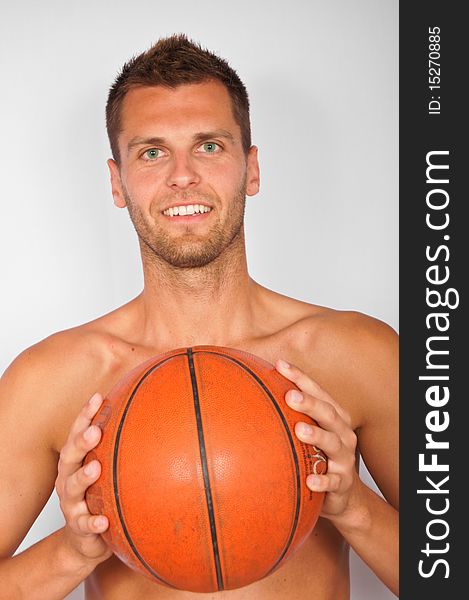 Young smiling man with basketball ball. Young smiling man with basketball ball