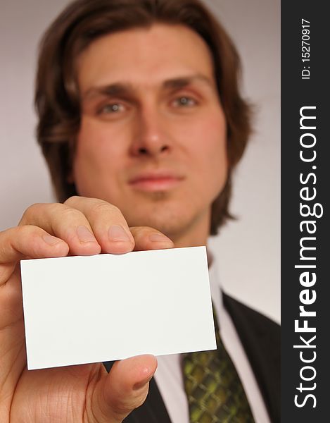 Young man shows business card. You can there write text. Young man shows business card. You can there write text.