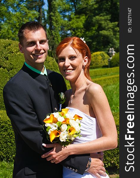 Young bride and groom in the garden