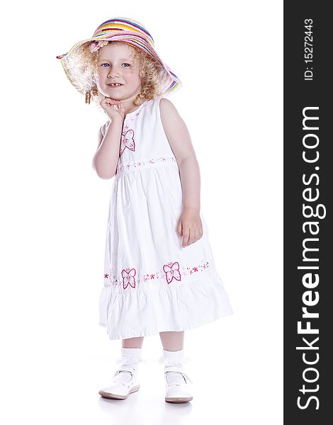 Small smiling baby in white dress on white background