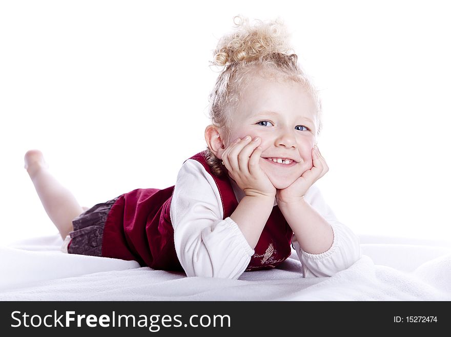 Small smiling baby in red dress on white background