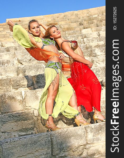 Beautiful belly dancers on the ancient stairs of Kourion amphitheatre in Cyprus.