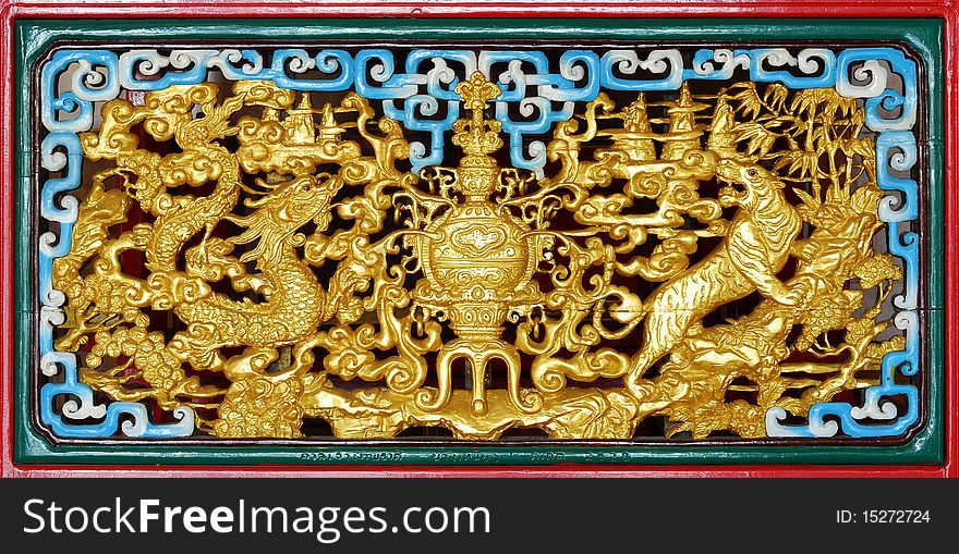 Gold pattern on a piece of carved wood Chinese art ,generality in thailand , any kind of art decorated in budhist church ,temple pavilion ,temple hall ,monk's house petc .created with money donated by peole to hire artist .they are public domain or treasure off buddhism , no restrict in copy or use ,no name of artist appear (but,if there is artist name , it only for tell who is the artist of work , not for copyright). this photo is taken under these conditions. Gold pattern on a piece of carved wood Chinese art ,generality in thailand , any kind of art decorated in budhist church ,temple pavilion ,temple hall ,monk's house petc .created with money donated by peole to hire artist .they are public domain or treasure off buddhism , no restrict in copy or use ,no name of artist appear (but,if there is artist name , it only for tell who is the artist of work , not for copyright). this photo is taken under these conditions