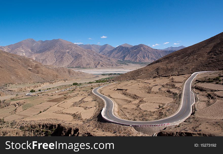 Yellowish mountain road view in tibet of China