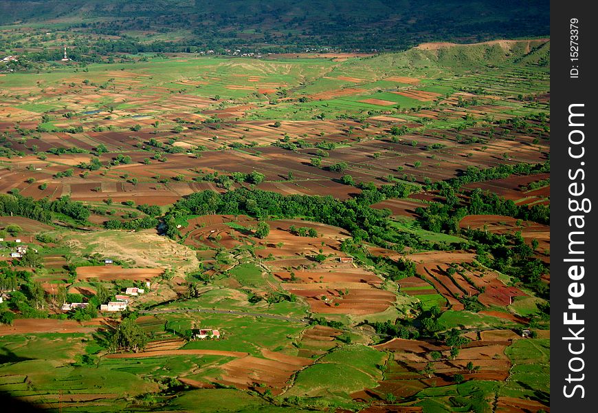 A vast view of landscape with paddy fields and uncultivated land. A vast view of landscape with paddy fields and uncultivated land.