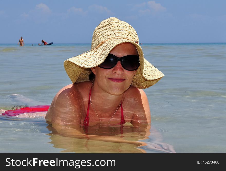 Girl With Straw Hat In Sea