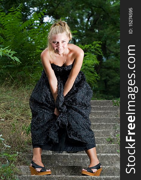 Posh young woman posing in the park