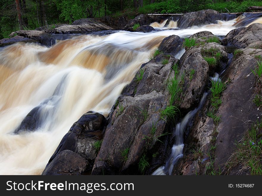 Faster stream waterfall at rocks