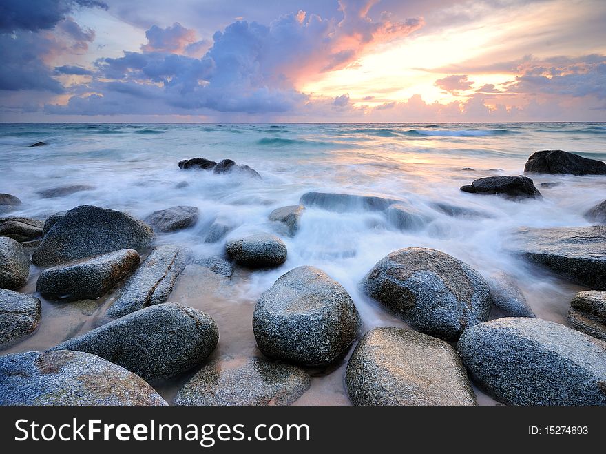 Sea waves lash line impact rock on the beach. Sea waves lash line impact rock on the beach