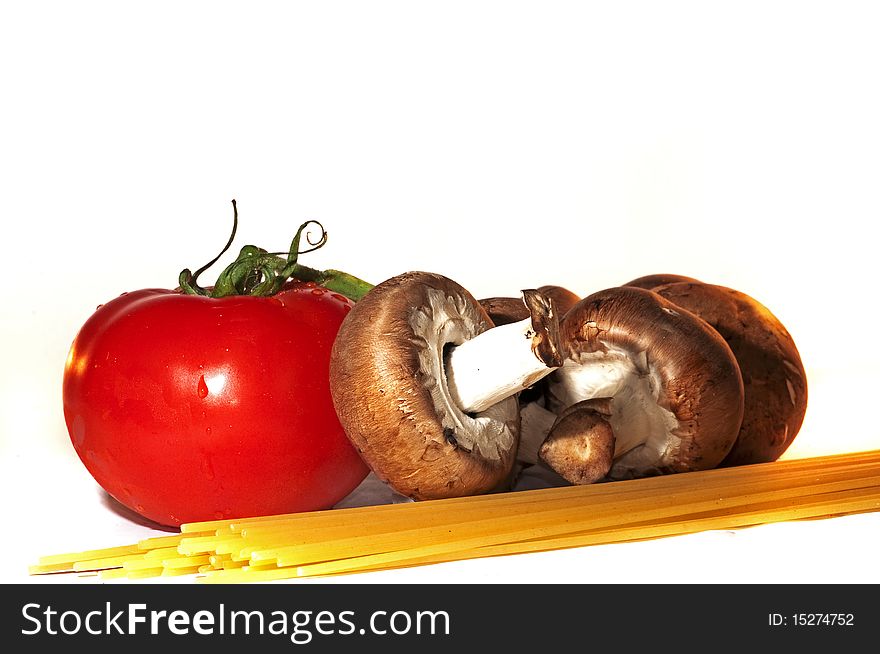 Mushrooms, tomato and spaghetti arrangement isolated