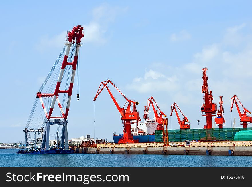 Mang cranes against blue skyï¼Œwhich taken in Qingdao Port China. Mang cranes against blue skyï¼Œwhich taken in Qingdao Port China