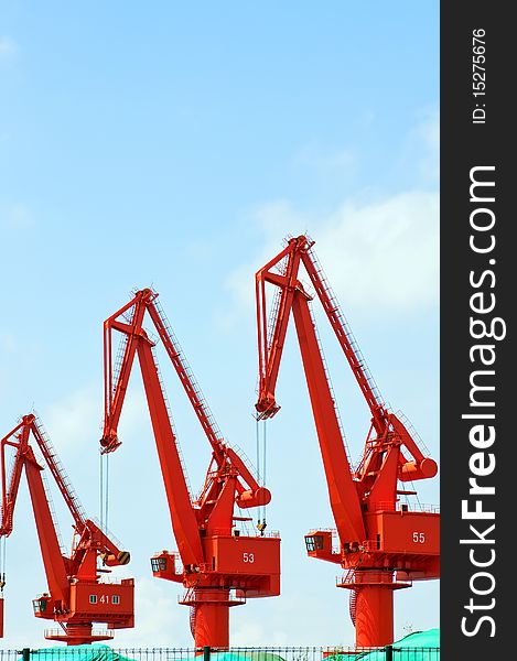 Mang cranes against blue skyï¼Œwhich taken in Qingdao Port China. Mang cranes against blue skyï¼Œwhich taken in Qingdao Port China