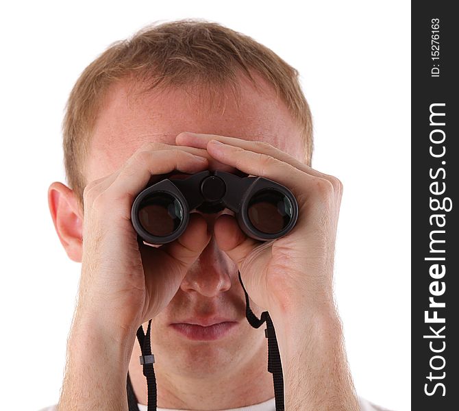 Young man searching for something with binoculars over white background