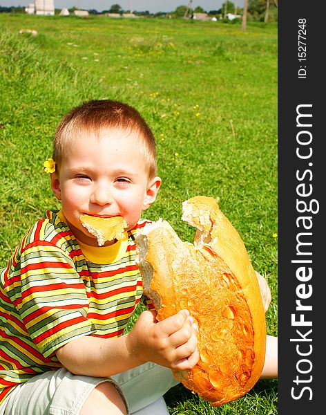 Boy bitten by a loaf of bread