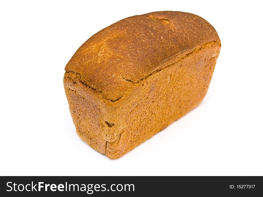 A loaf of fresh rye bread rectangular shape on a white background. A loaf of fresh rye bread rectangular shape on a white background