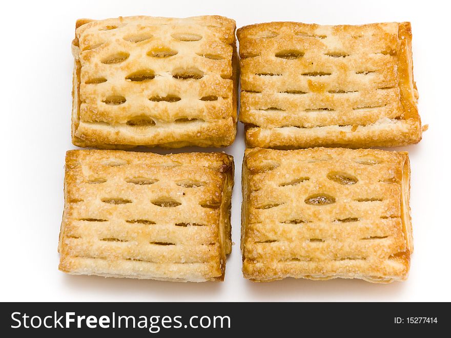 Four cookies lying on a white background, top view. Four cookies lying on a white background, top view