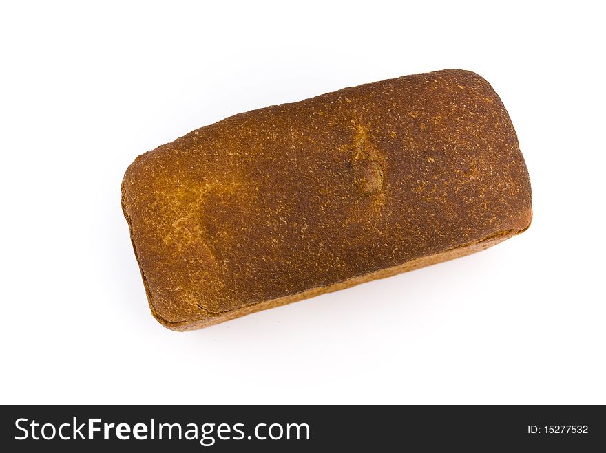 A loaf of fresh rye bread rectangular shape on a white background, top view