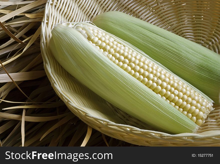 A close up of corn on the cob in a basket. A close up of corn on the cob in a basket