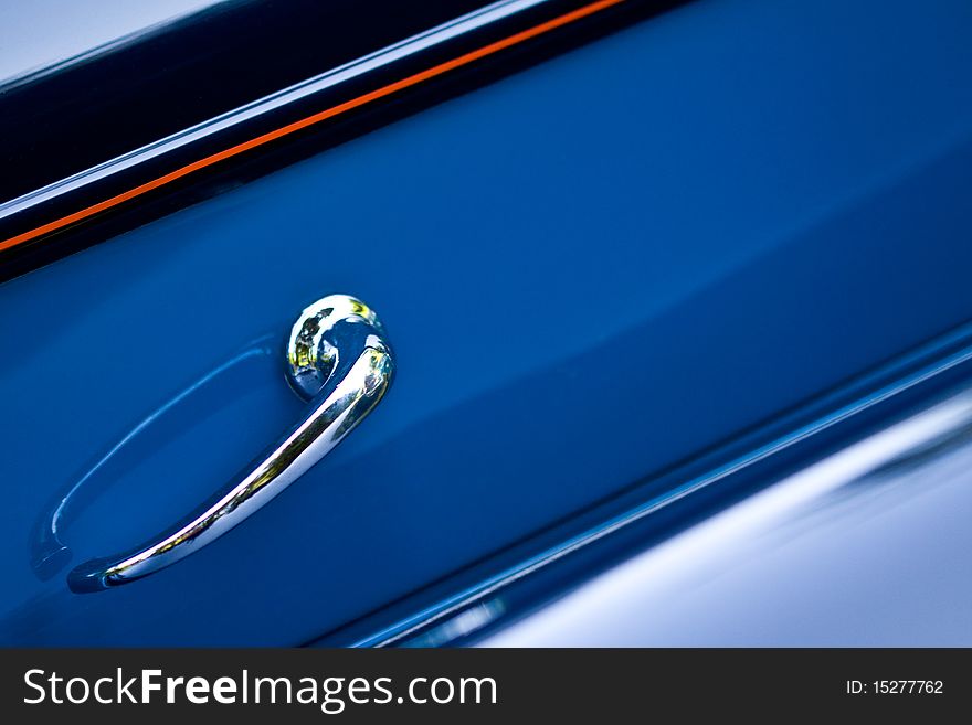 Closeup on shiny door handle of retro car. Closeup on shiny door handle of retro car