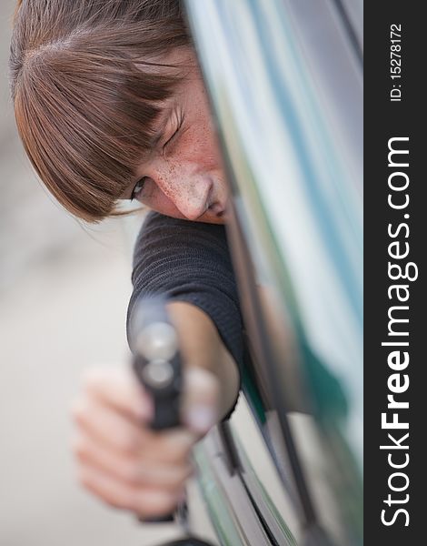 Woman Shooting From A Car