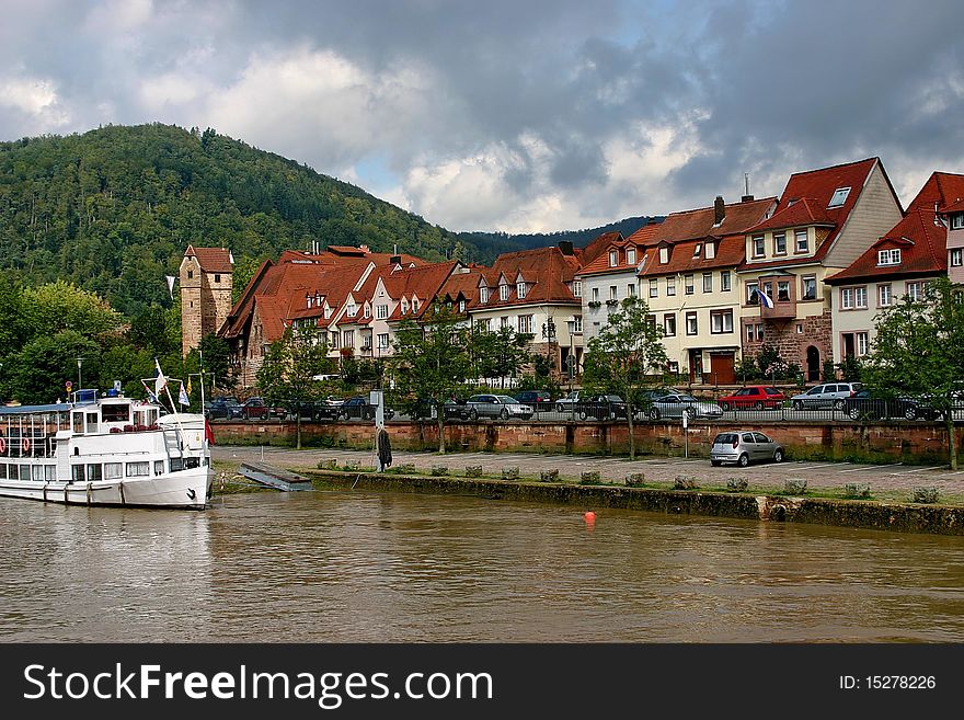 The stroll on the motor vessel . The township and green the hill on the beach of the river