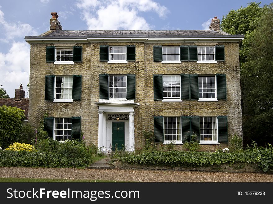 View of a grand old house in a village in Kent, England, which is in need of some repair. View of a grand old house in a village in Kent, England, which is in need of some repair.